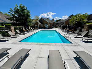 Community pool featuring a patio area