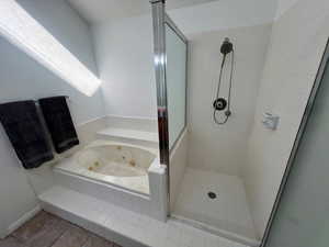 Master Bathroom featuring a stall shower and a jetted tub