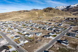 Aerial perspective of suburban area featuring a mountain backdrop