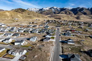 Aerial view of residential area featuring a mountain backdrop