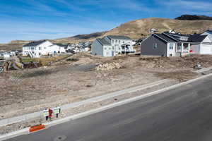 View of front of house with a mountain view and a residential view