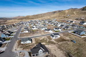 Aerial perspective of suburban area with a mountain backdrop