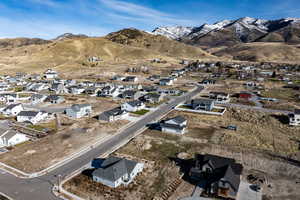 Aerial view of residential area featuring a mountain backdrop