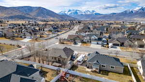 Aerial view of residential area featuring mountains