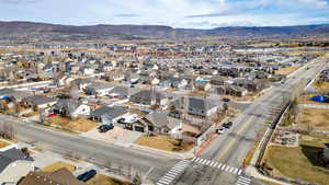 View of property location with a mountain backdrop and nearby suburban area