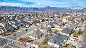 Aerial perspective of suburban area featuring a mountain backdrop