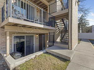Entrance to property featuring brick siding
