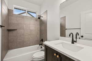 Bathroom with shower / bathtub combination and vanity