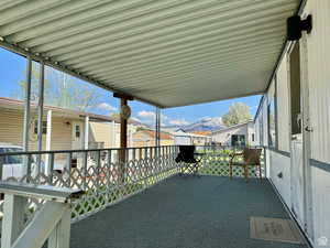 View of patio / terrace featuring a mountain view and a carport