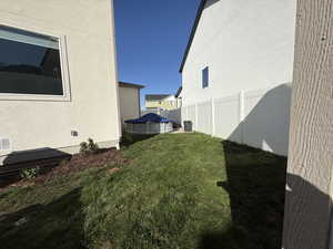 Fenced yard featuring a covered pool