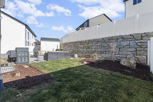 Fenced backyard featuring an outdoor hangout area, and patio