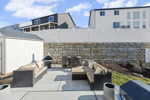 View of patio / terrace, area for grilling, and a shed