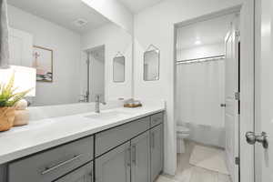 Full bathroom with vanity and shower / bath combination