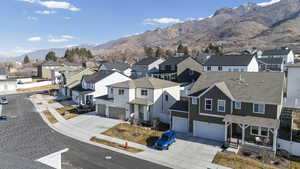 Aerial view of residential area featuring a mountainous background