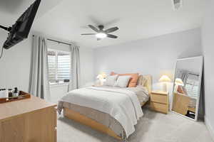 Bedroom featuring light carpet and ceiling fan