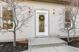 Property entrance with stucco siding