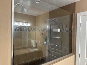 Bathroom featuring a textured ceiling