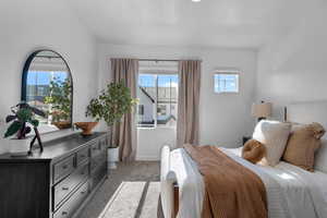 Carpeted bedroom featuring baseboards