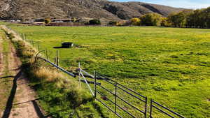 View of yard featuring a view of countryside and a mountain view