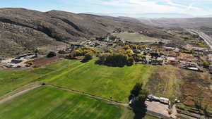Aerial view of property's location featuring rural landscape and mountains