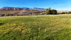 View of mountain background featuring rural landscape