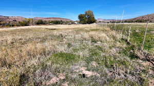 View of mountain background featuring rural landscape