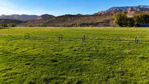 Mountain view featuring a pastoral area and rural landscape