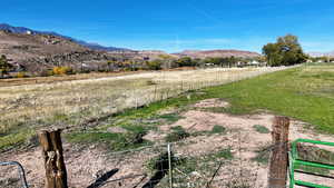 View of mountain backdrop with rural landscape