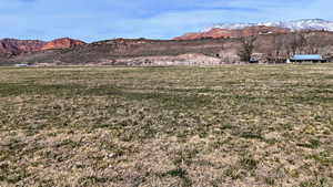 View of mountain backdrop with rural landscape