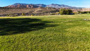 View of mountain backdrop featuring rural landscape
