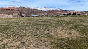 View of mountain backdrop featuring rural landscape