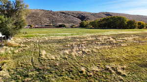 View of mountain backdrop featuring rural landscape