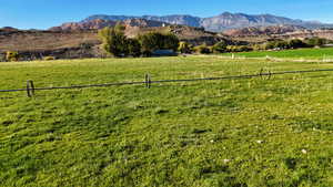 View of mountain backdrop with rural landscape and a pastoral area