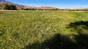 View of mountain backdrop with rural landscape