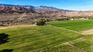 View of mountain backdrop featuring rural landscape