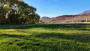 View of mountain background featuring rural landscape