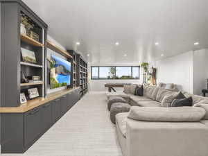 Living room featuring recessed lighting and light colored carpet