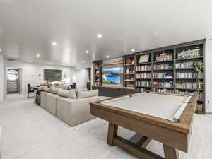 Rec room featuring light carpet, recessed lighting, and pool table