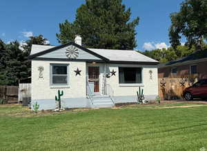 View of front facade featuring a chimney