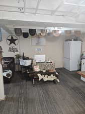 Dining room with dark colored carpet