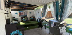 View of patio featuring a grill