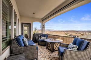 View of patio / terrace with area for grilling, a mountain view, and an outdoor living space with a fire pit