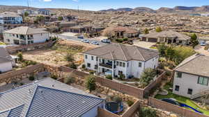 Aerial view of residential area featuring a mountain backdrop