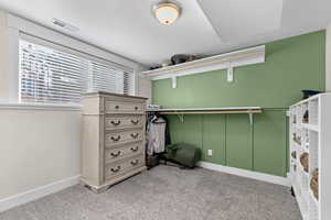 Walk in closet featuring carpet