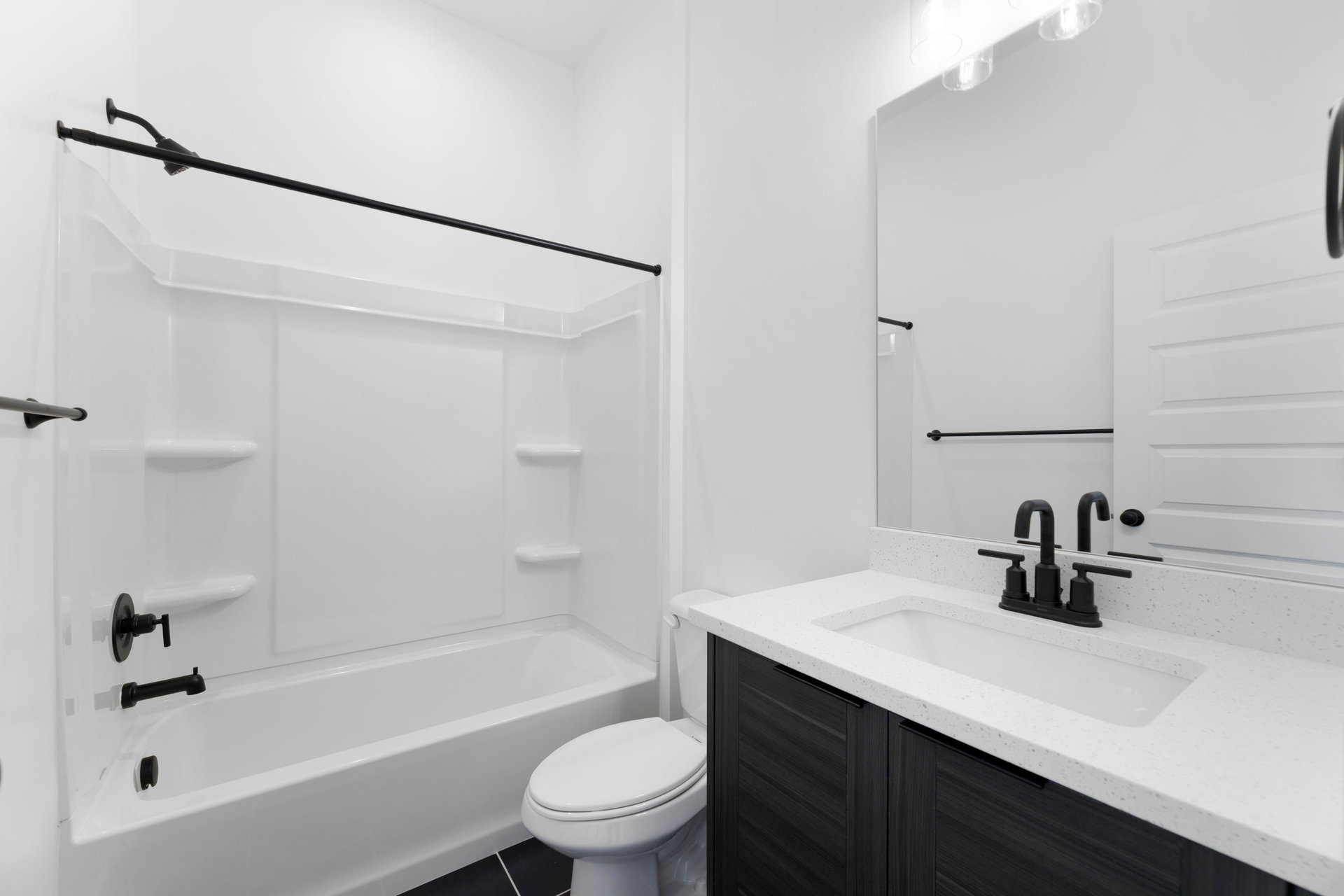 Bathroom featuring vanity and  shower combination
