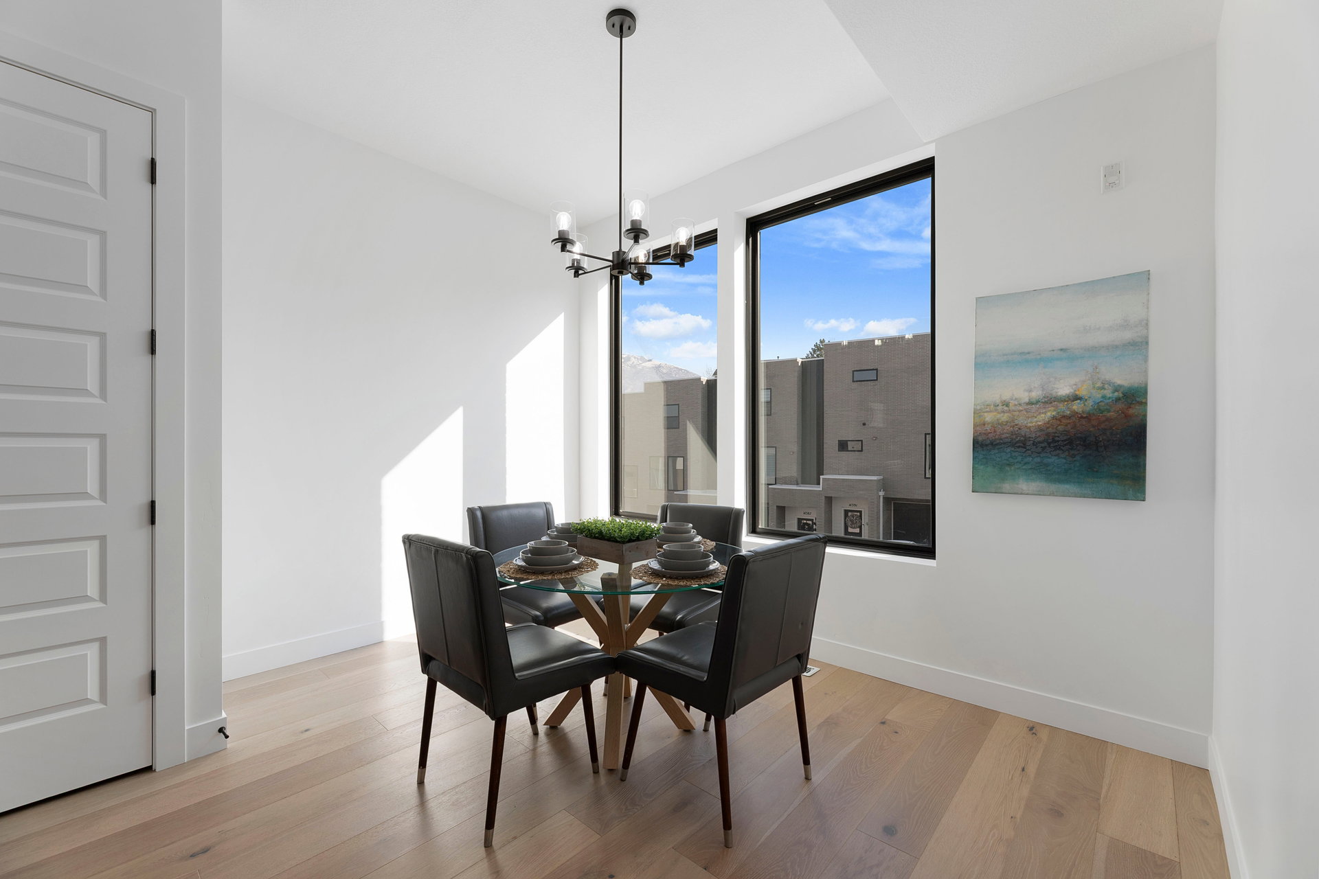 Dining room featuring light wood-style flooring and hanging lights