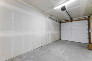 Garage featuring a garage door opener