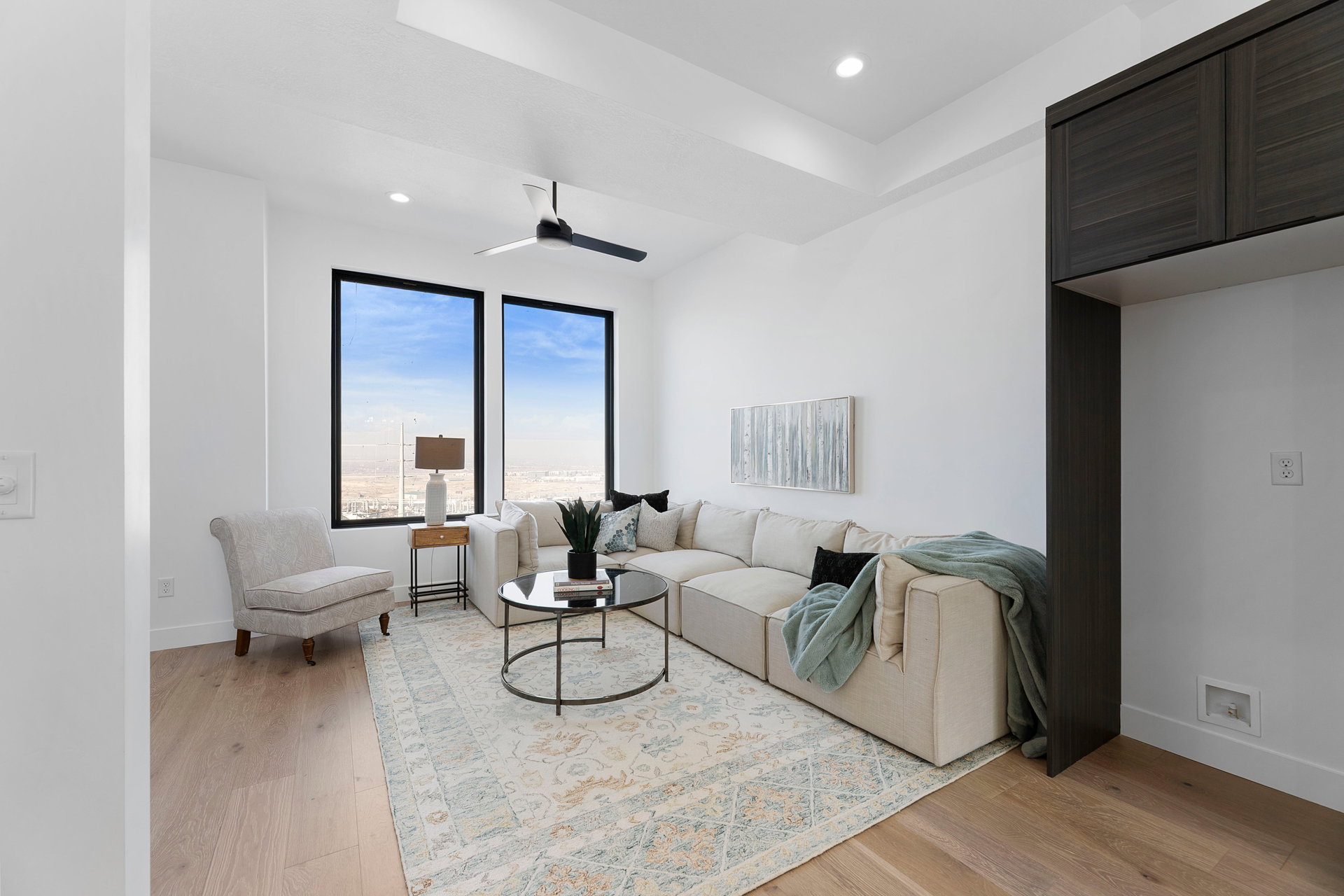 Living room featuring light wood finished floors, recessed lighting, and ceiling fan