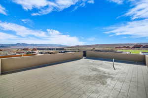 View of patio / terrace featuring a deck with mountain view