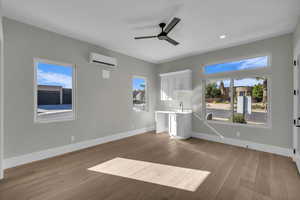 Unfurnished living room with a ceiling fan, light wood-style flooring, and recessed lighting